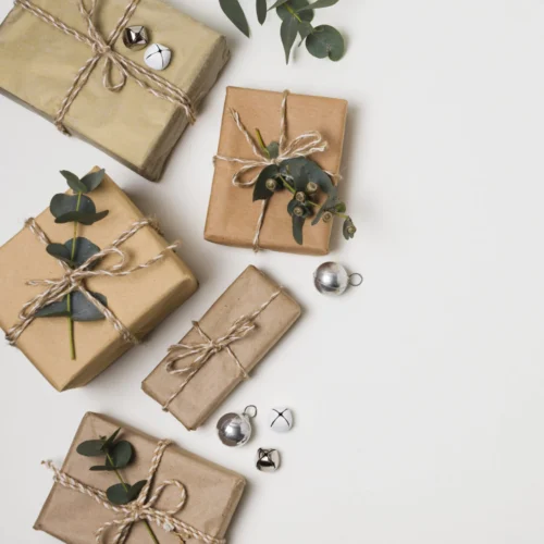 Gifts wrapped in kraft paper with twine and eucalyptus