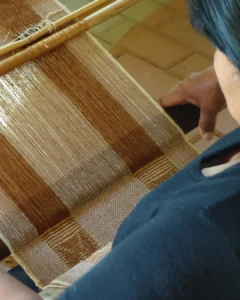 Weaver working bamboo linen on a handloom
