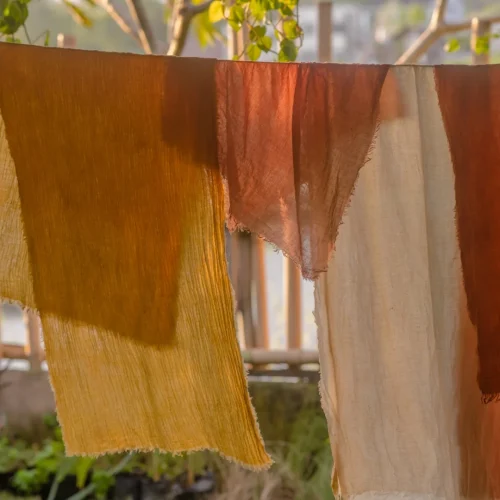 Naturally dyed fabrics drying in the sun